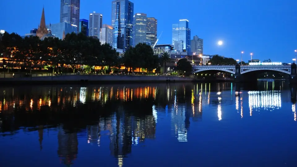 Melbourne city skyline at night reflected in the Yarra River